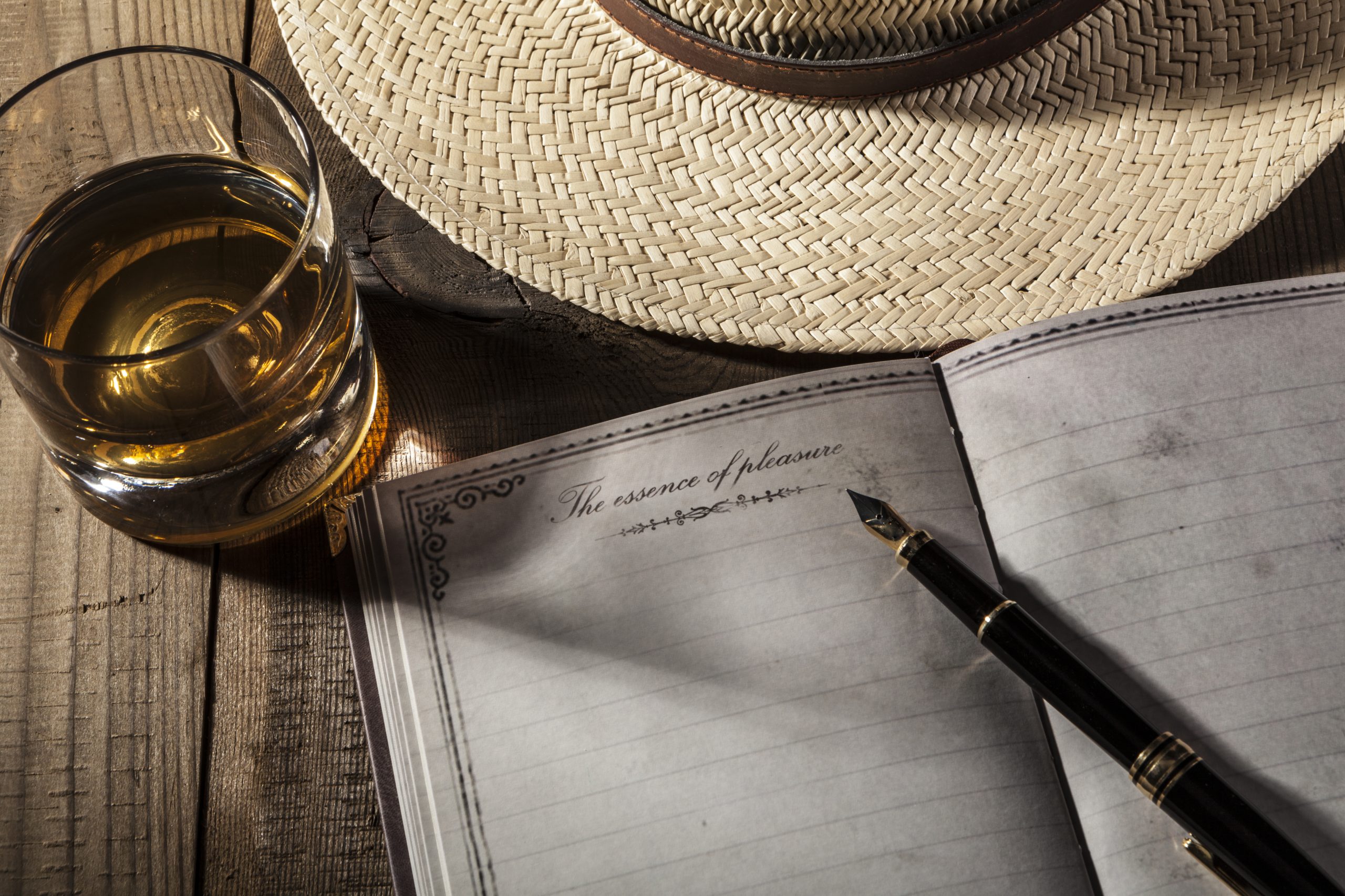 Notebook and Alcohol on background refer to Membership - RahaWeb